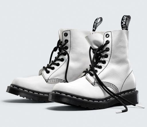 A pair of the boots in white, set up to demonstrate how soft the leather is