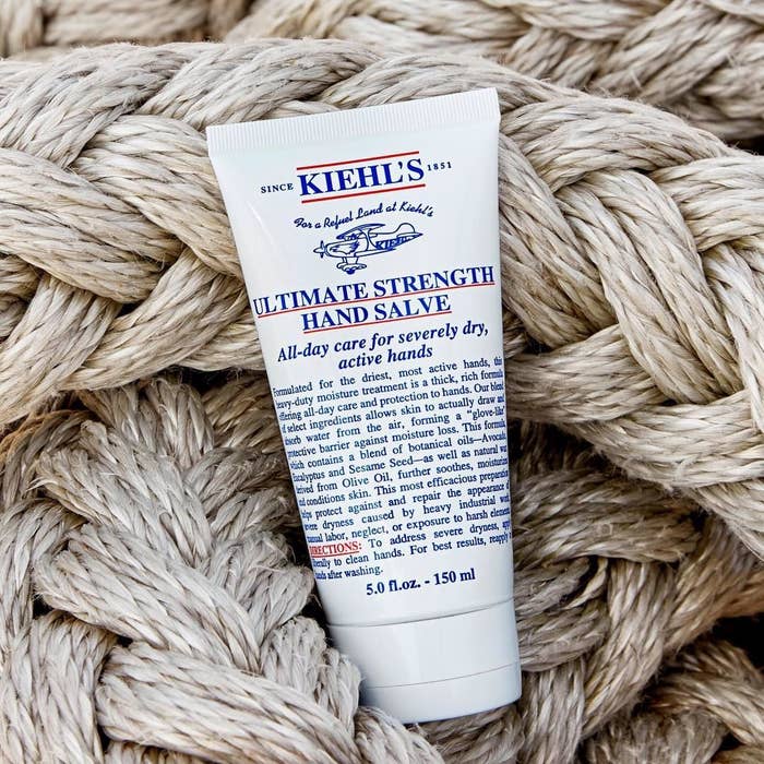A tube of hand cream lying on a pile of braided rope