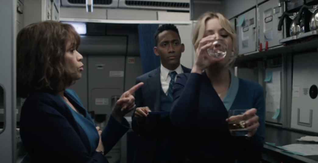 Kaley Cuoco&#x27;s &quot;Flight Attendant&quot; character drinking in the galley of a plane