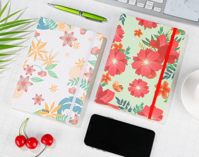 Two vibrant journals on a desk 