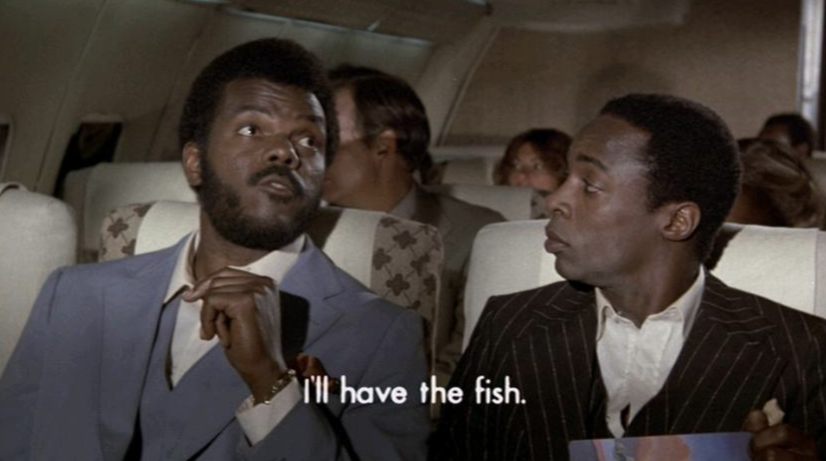 Two men ordering their meals on a flight in the movie &quot;Airplane!&quot;