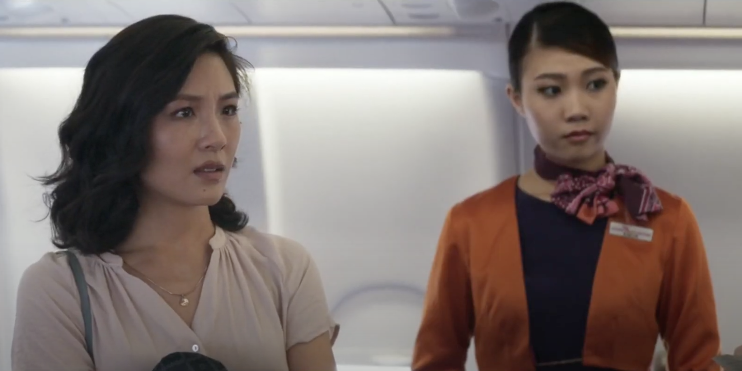 Rachel and a flight attendant in &quot;Crazy Rich Asians&quot;