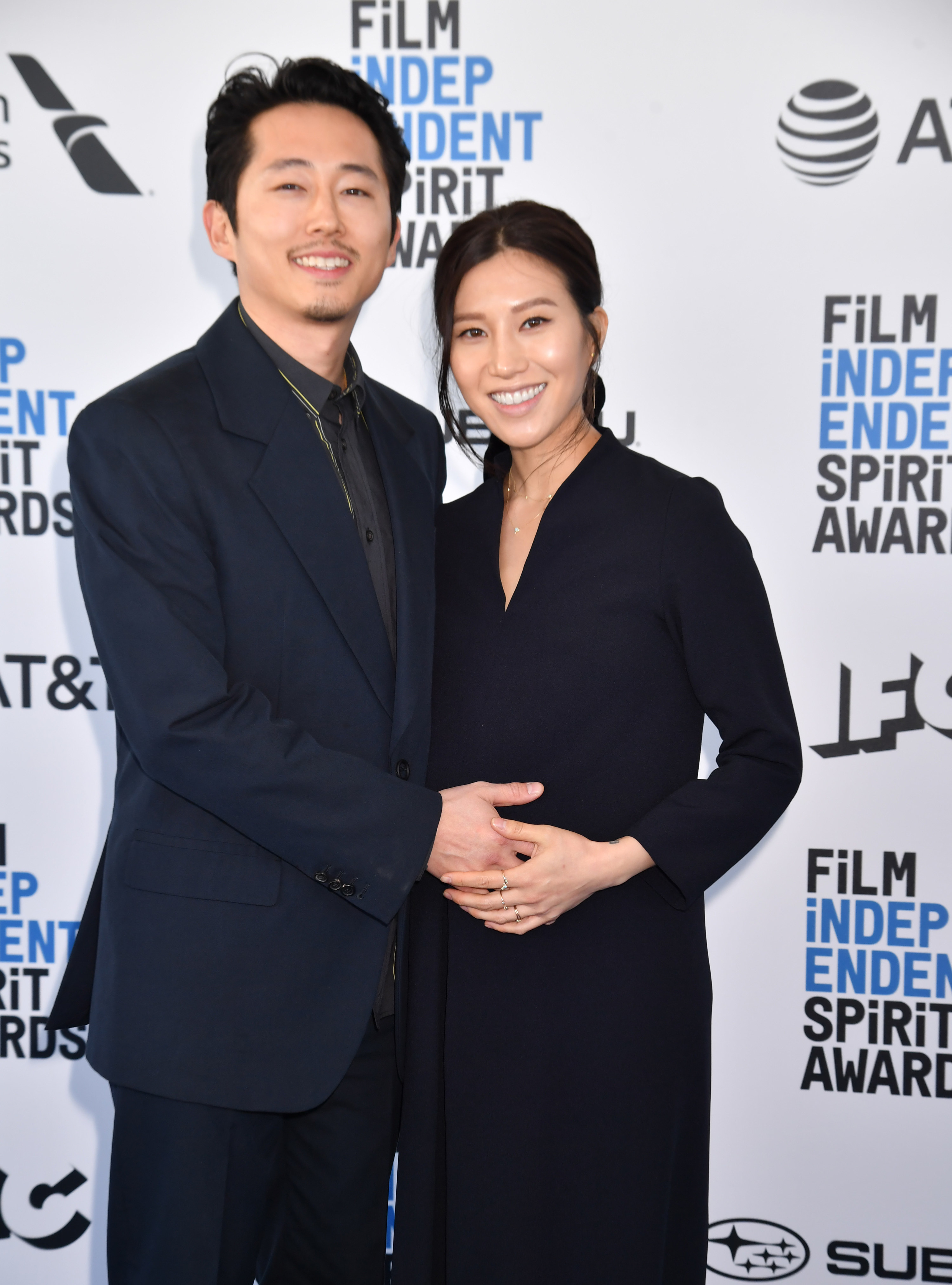 Steven Yeun and Joana Pak posing together