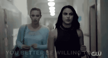 Veronica and Betty walking down a hall 