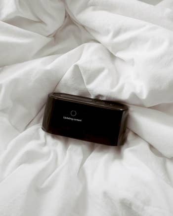 the alarm clock in a bed updating