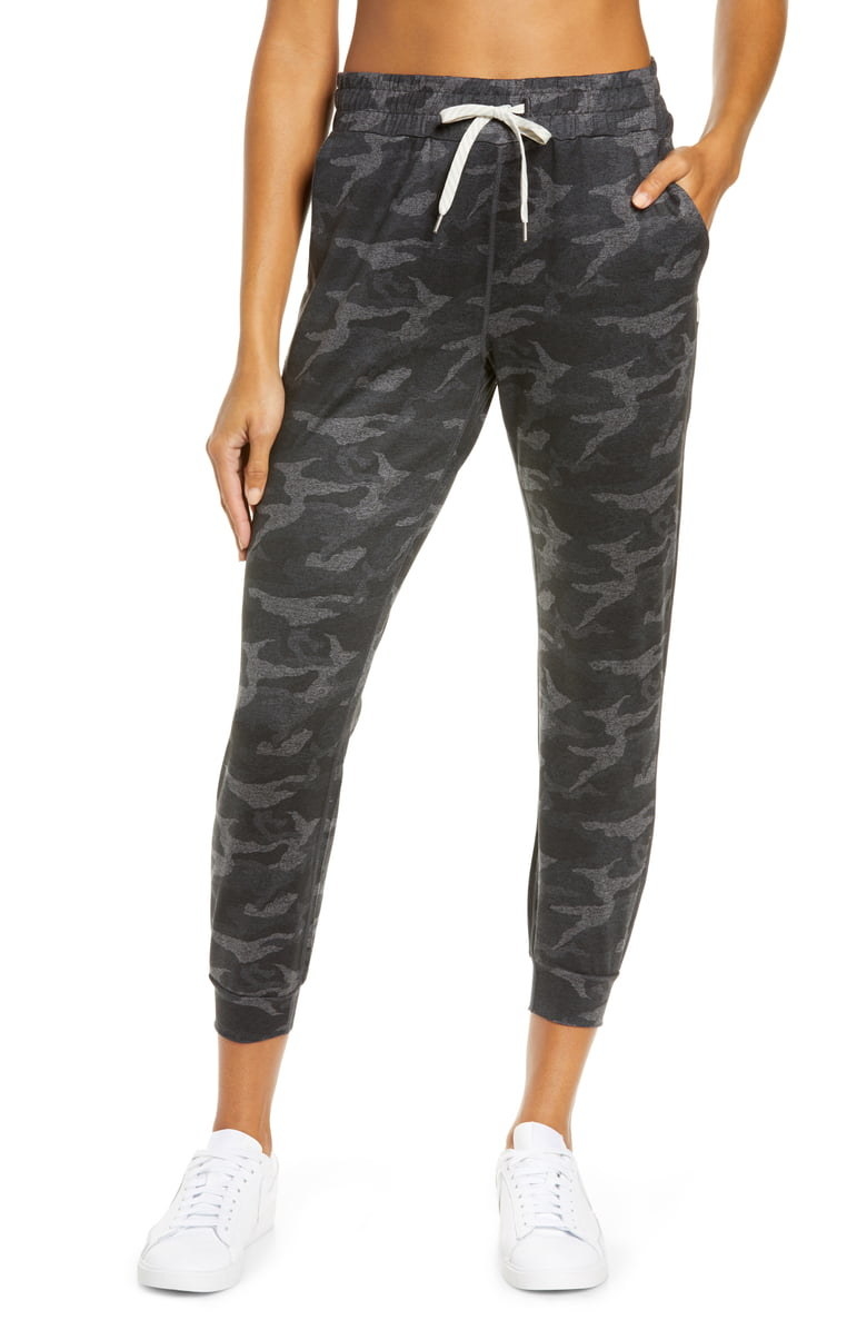 black and grey camo jogger pants with a white drawstring 