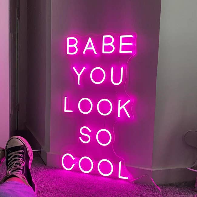 A neon sign that reads, 