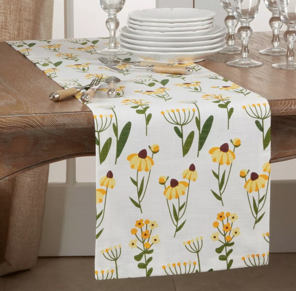 The table runner laid across a set table