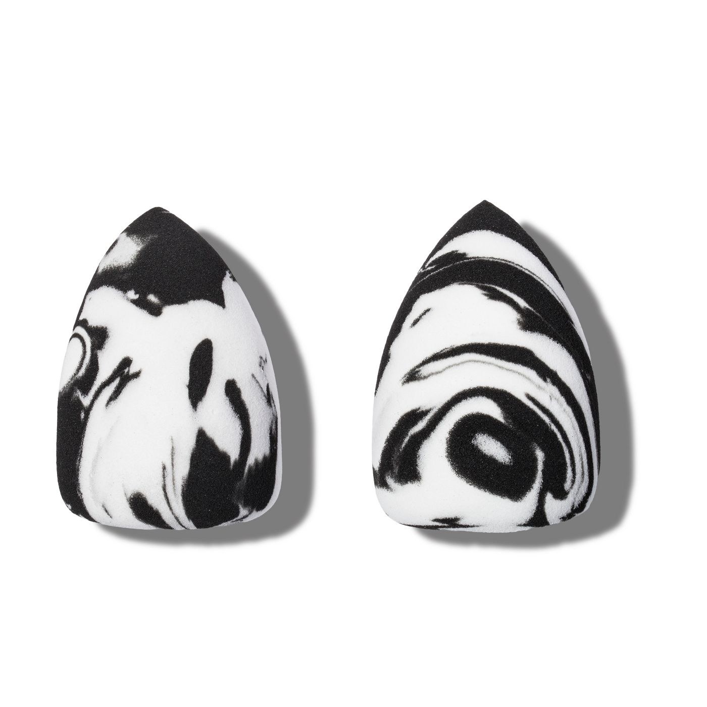Two black and white marble printed makeup sponges
