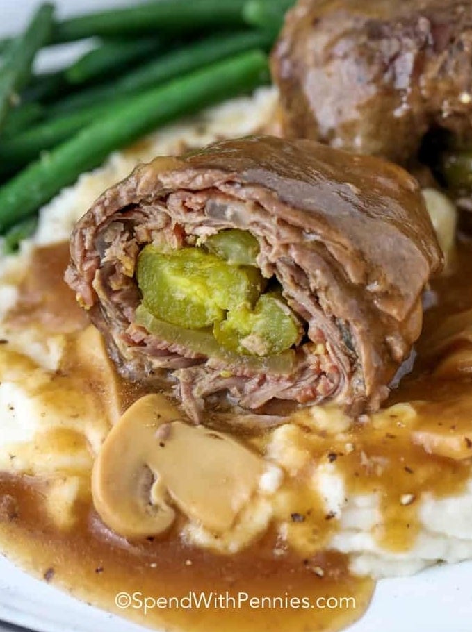 Beef rouladen stuffed with bacon, onion, and pickles.