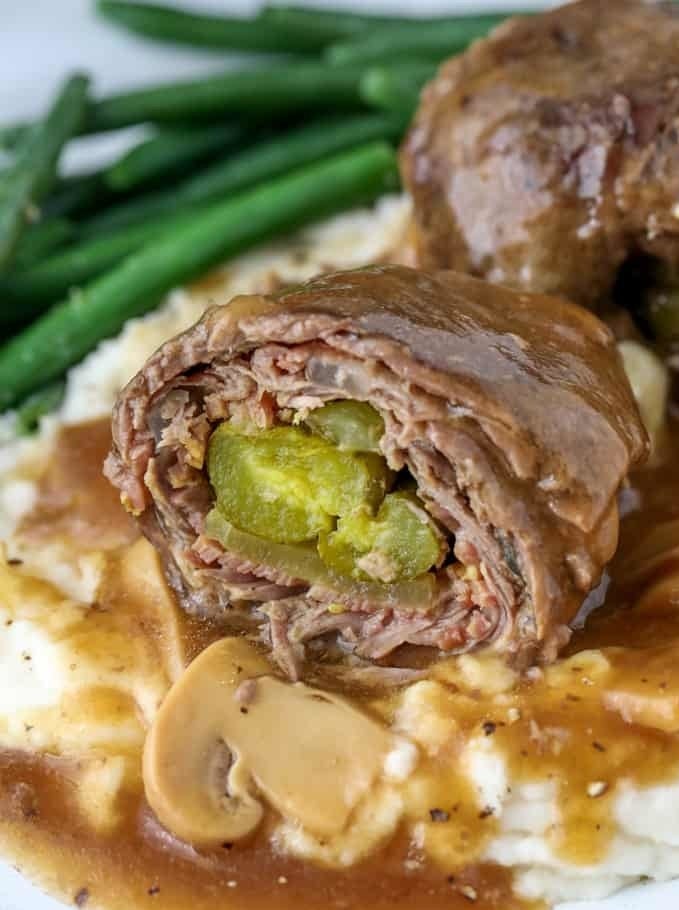 Beef rouladen stuffed with bacon, onion, and pickles.