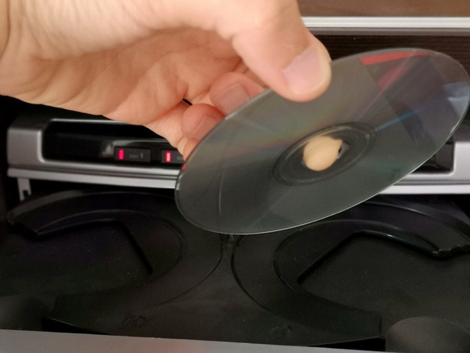 Inserting a CD disc into a CD player