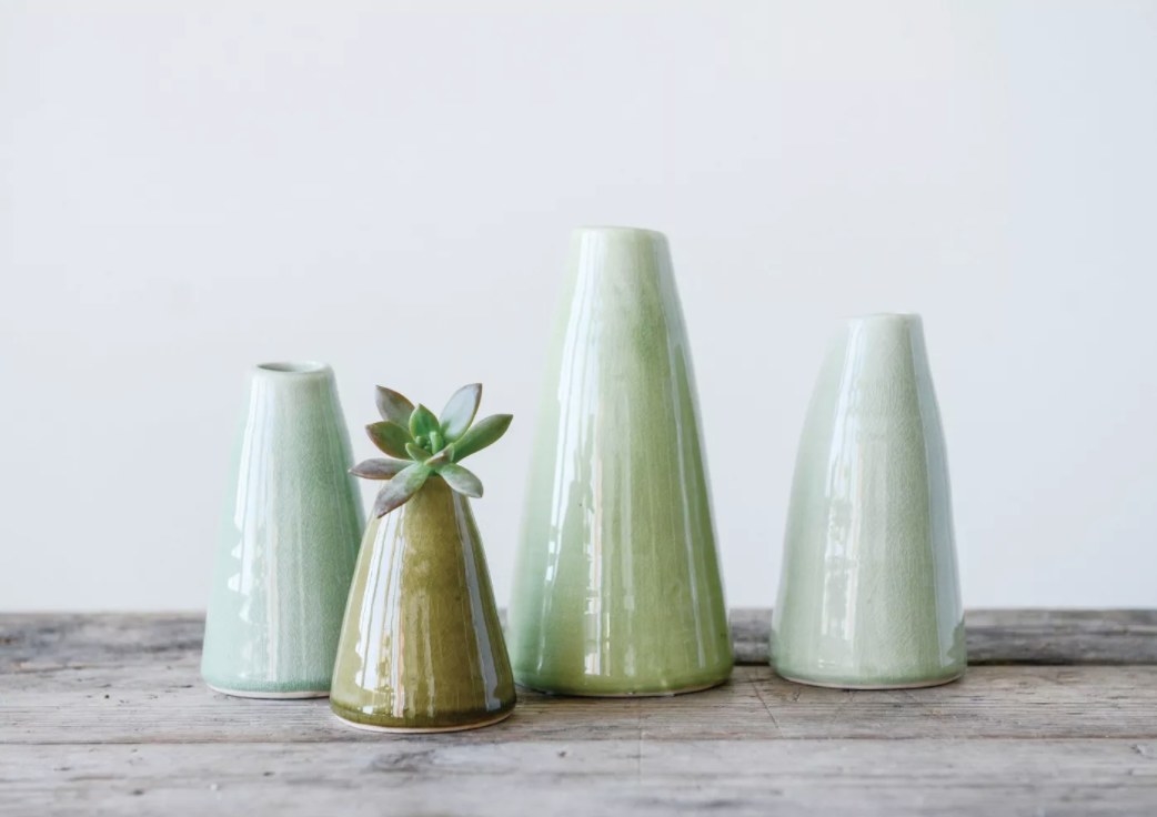 The four vases in green with one succulent 