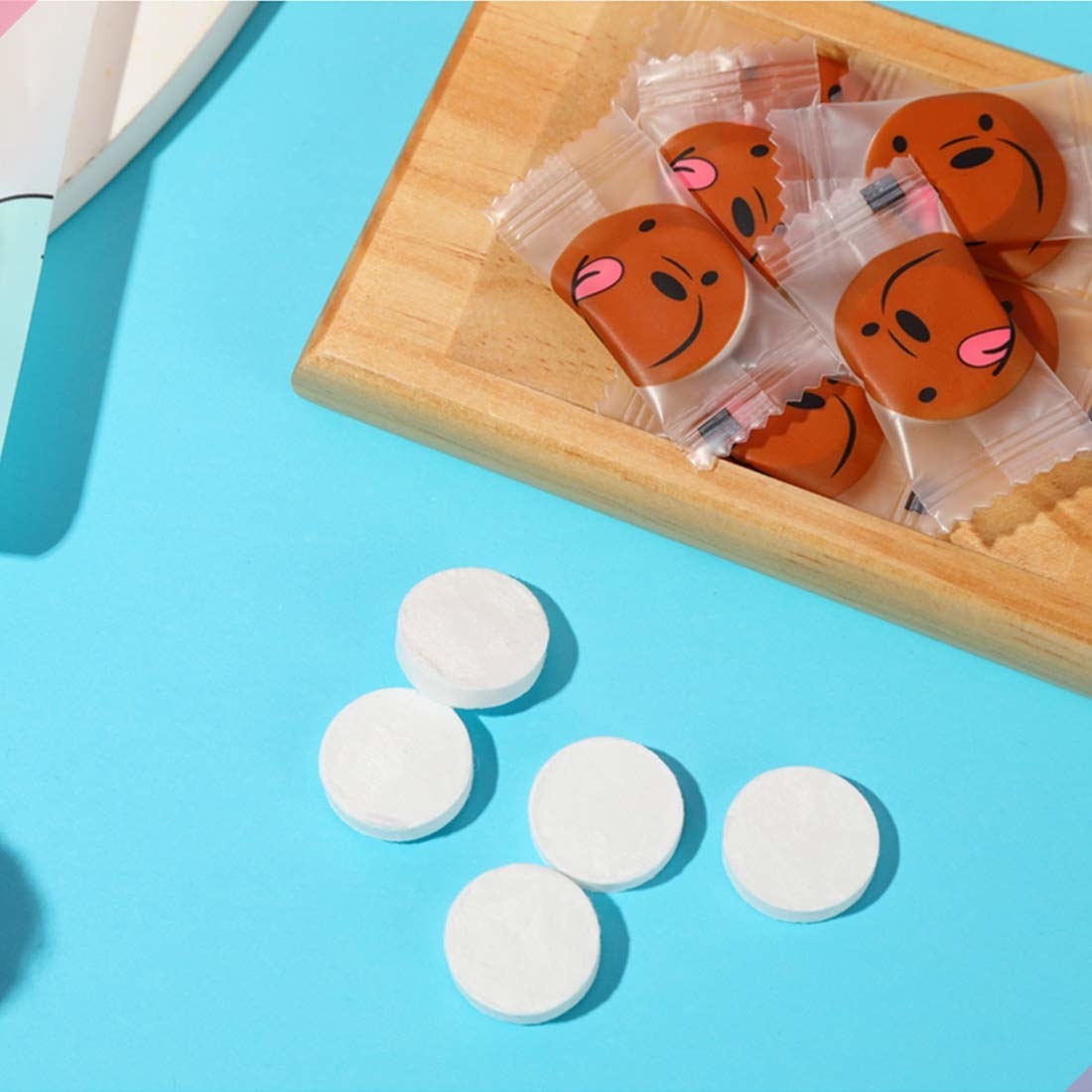 Compressed face mask tablets on a blue table 
