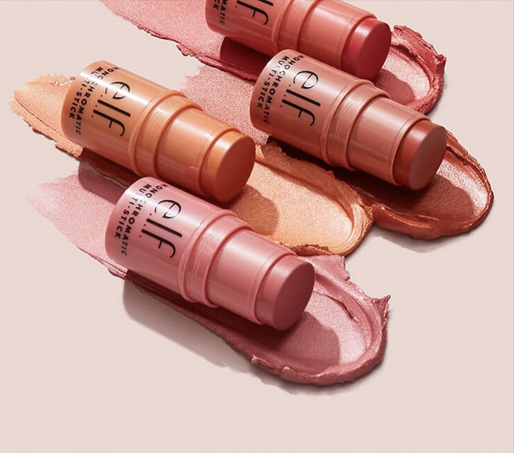 four tubes of shimmery eyeshadow lipstick blush sticks