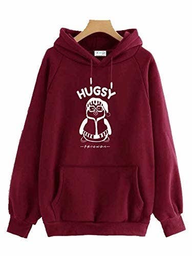 A maroon hoodie with Hugsy on it 