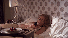 Serena suddenly sits up in bed while looking at her phone