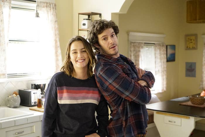 Adam Brody and Leighton Meester standing in a kitchen in the TV show Single Parents