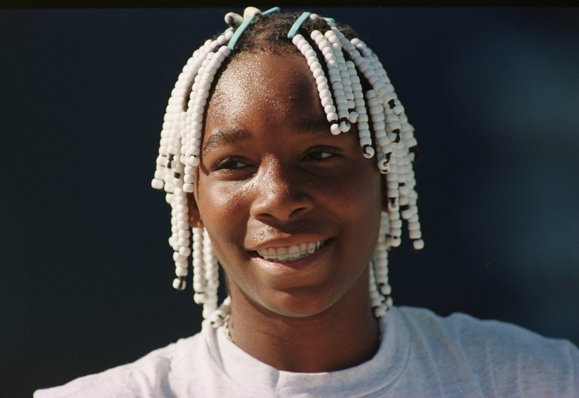 Young Venus Williams smiling.