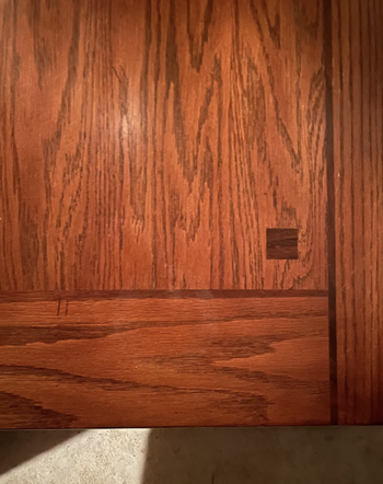 The same wooden surface completely clear of the stain