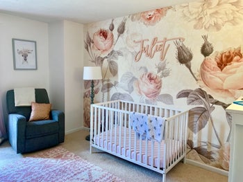 a different reviewer's nursery with the mural behind the crib