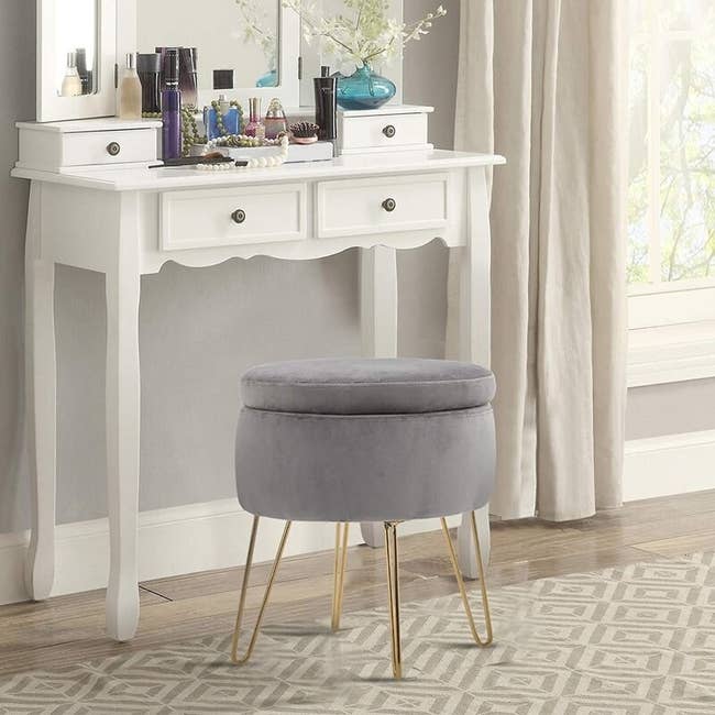 The storage ottoman in the color Gray