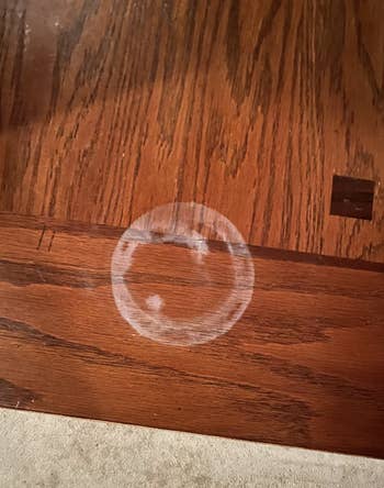 A wooden surface with a water mark stain 