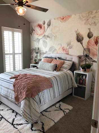 A reviewer's bedroom with the mural behind their bed