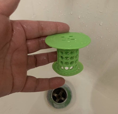 reviewer holding clean tubshroom before use