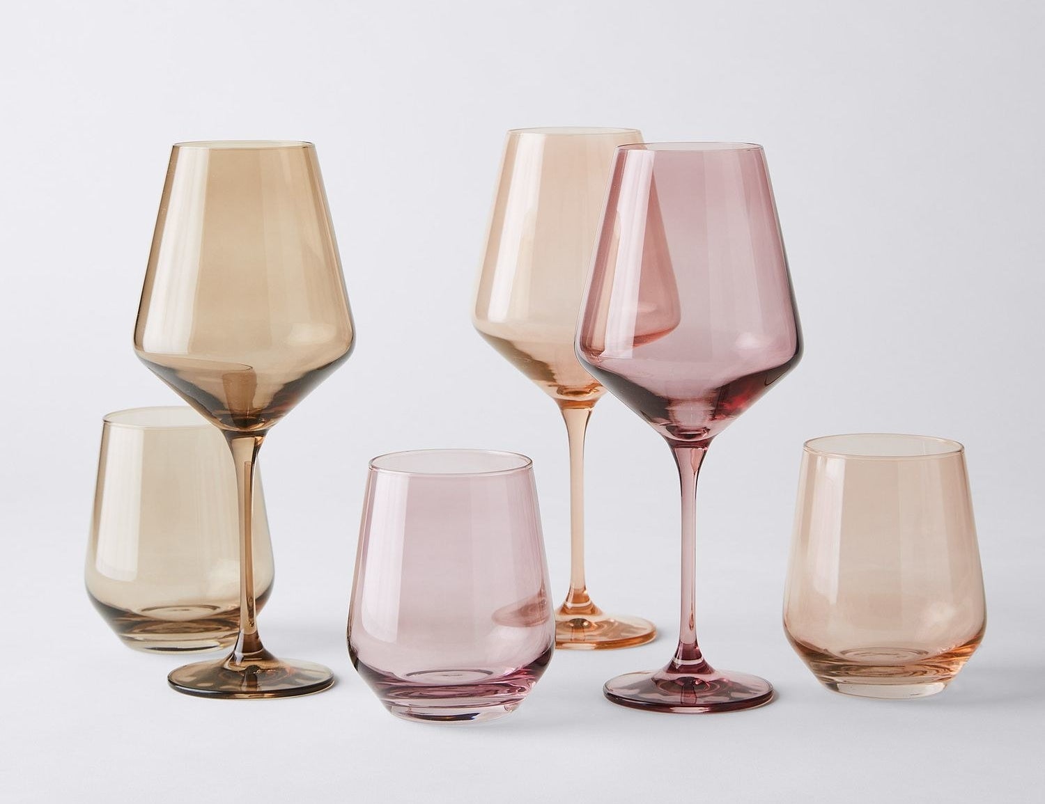 stemless and stemmed wine glasses in sunset hues