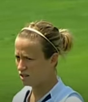 Young Megan Rapinoe on soccer pitch.