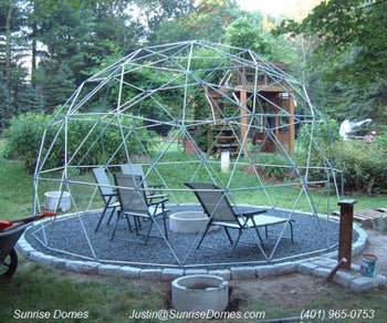 dome trellis over a seating area without any plants trained on it yet