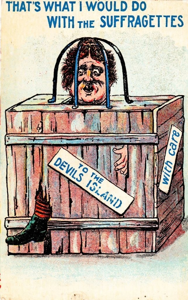 A woman in a box being sent to &quot;Devils Island,&quot; with the caption, &quot;That&#x27;s What I Would Do With The Suffragettes&quot;