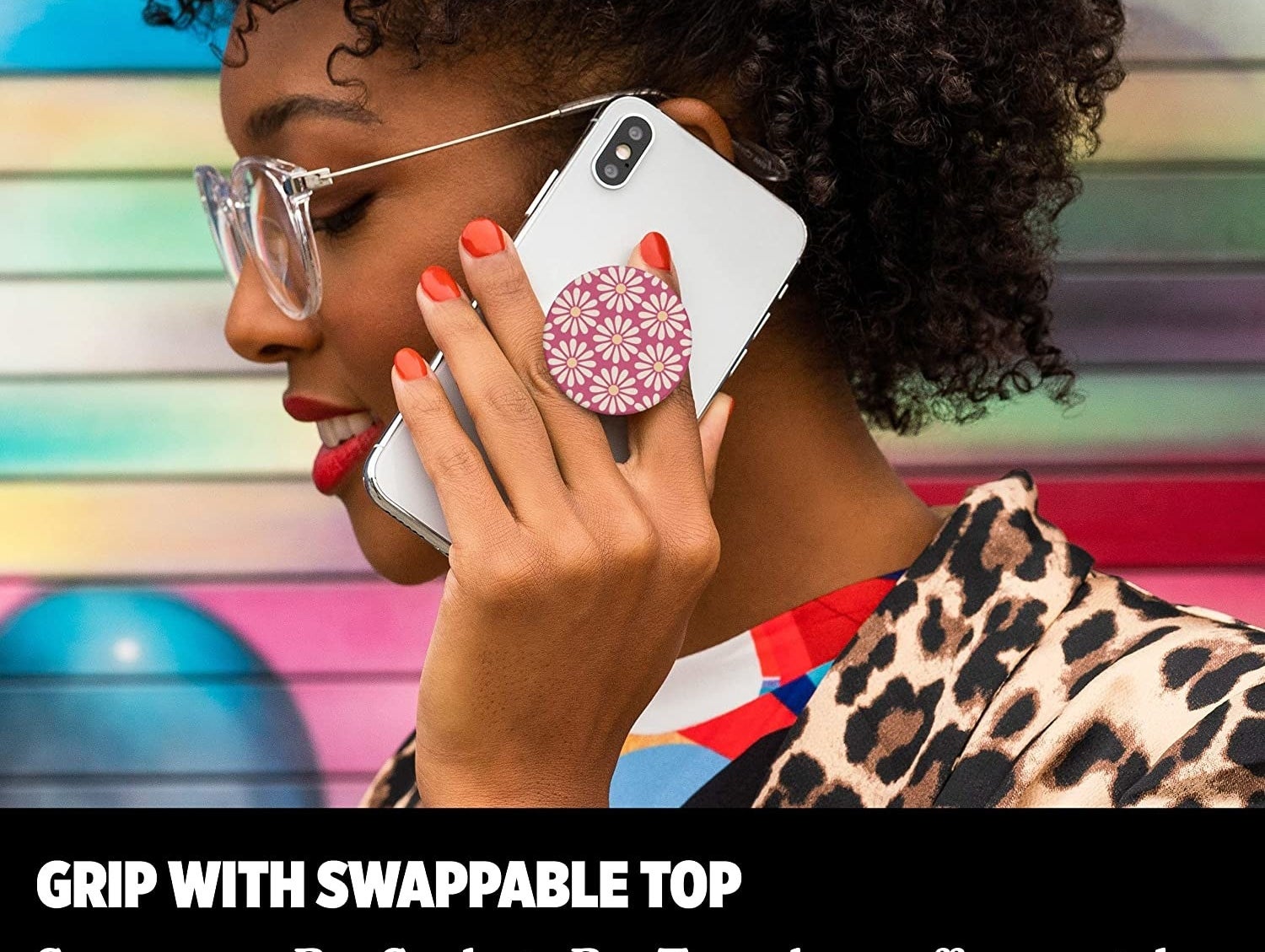 a model holding a phone with the pop socket