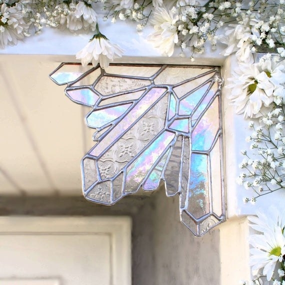 the stained glass corner piece on an outdoor entryway
