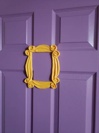 a closer up photo of a reviewer's door with the yellow frame on it