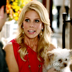 cheryl hines and a puppy