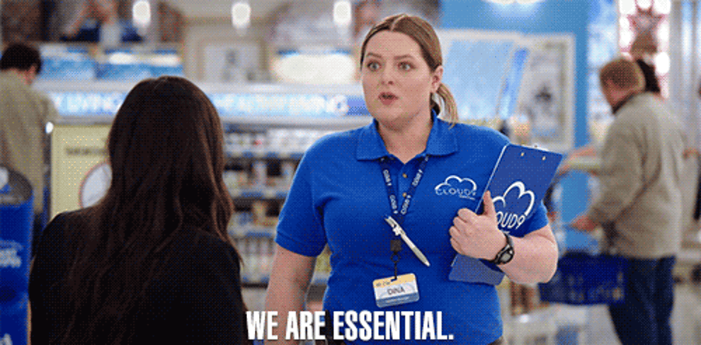 Gif of character from the show Super Store saying &quot;We are essential&quot; 