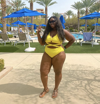 reviewer wearing the swimsuit in yellow