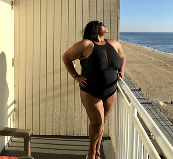 reviewer wearing the swimsuit in black