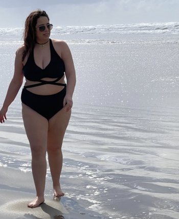 reviewer wearing the swimsuit in black
