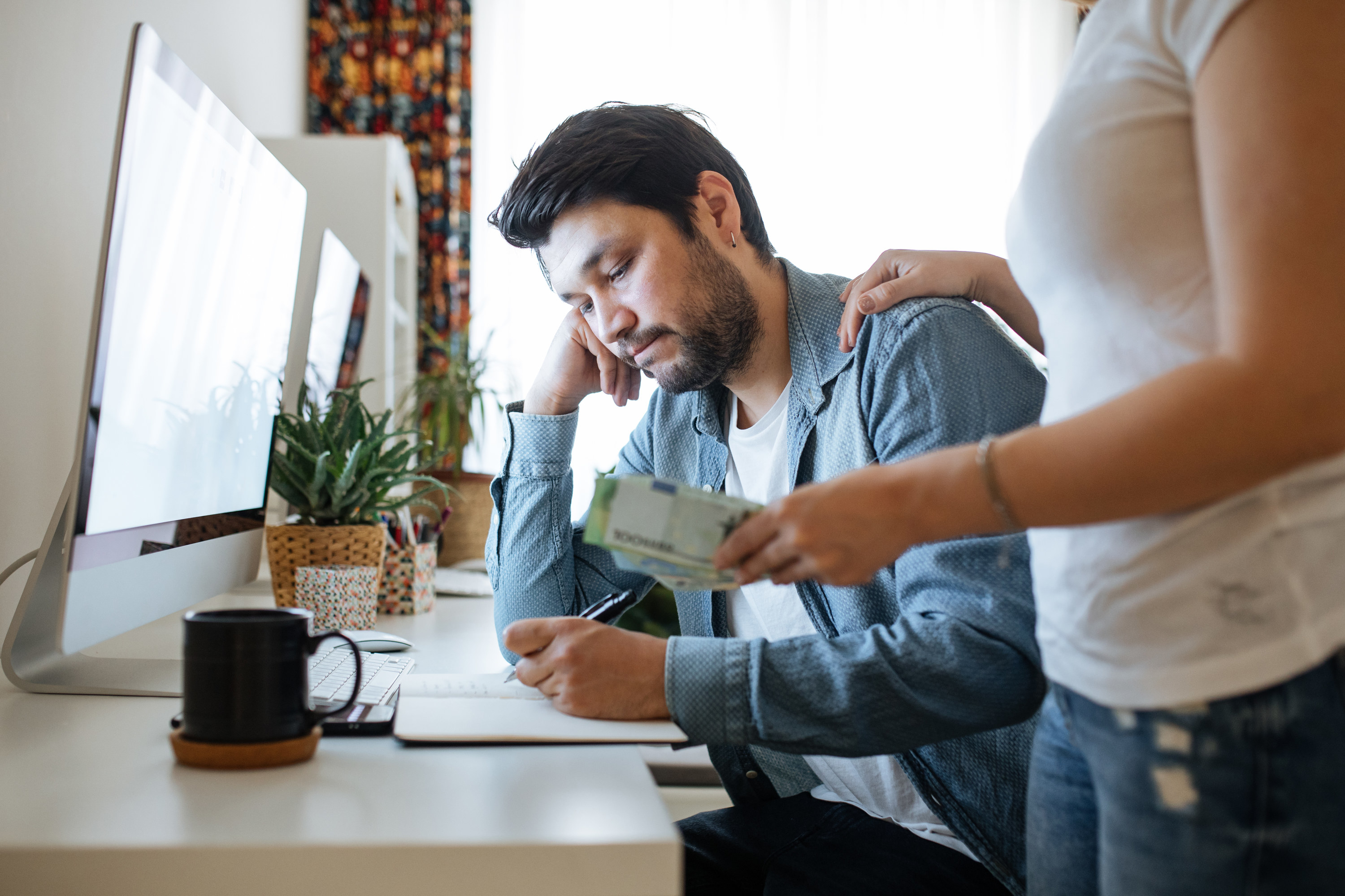 Couple looking stressed about money