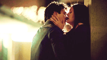 Damon and Elena kissing at the motel