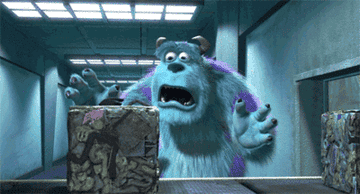 Sulley crying over a compacted trash cube he thinks contains Boo