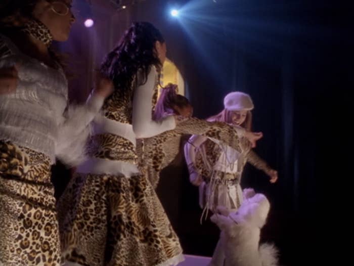 The Cheetah Girls performing on stage with Toto