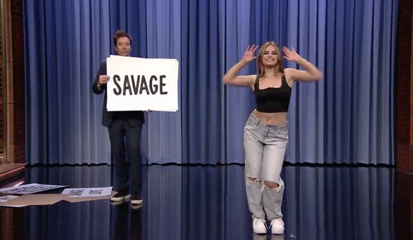 Addison Rae dancing while Jimmy Fallon holds a cue card on The Tonight Show With Jimmy Fallon