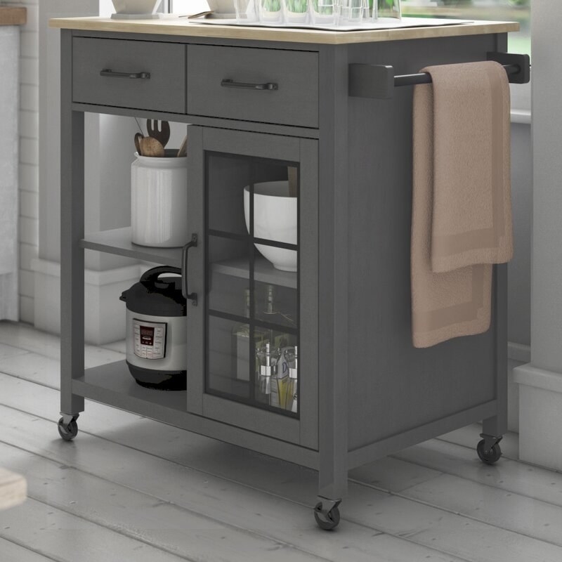 Gray rolling kitchen island with two drawers, open shelving, and cabinet