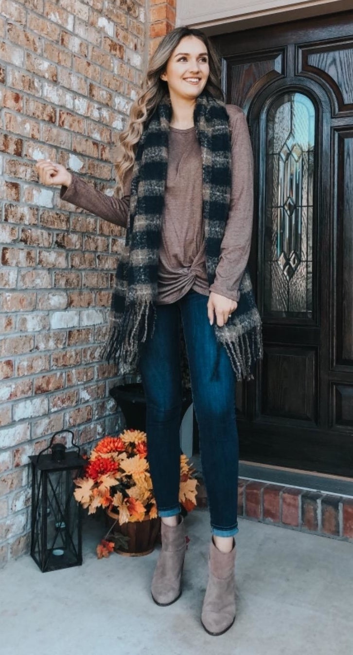 Reviewer wearing the brown top with twist front detail