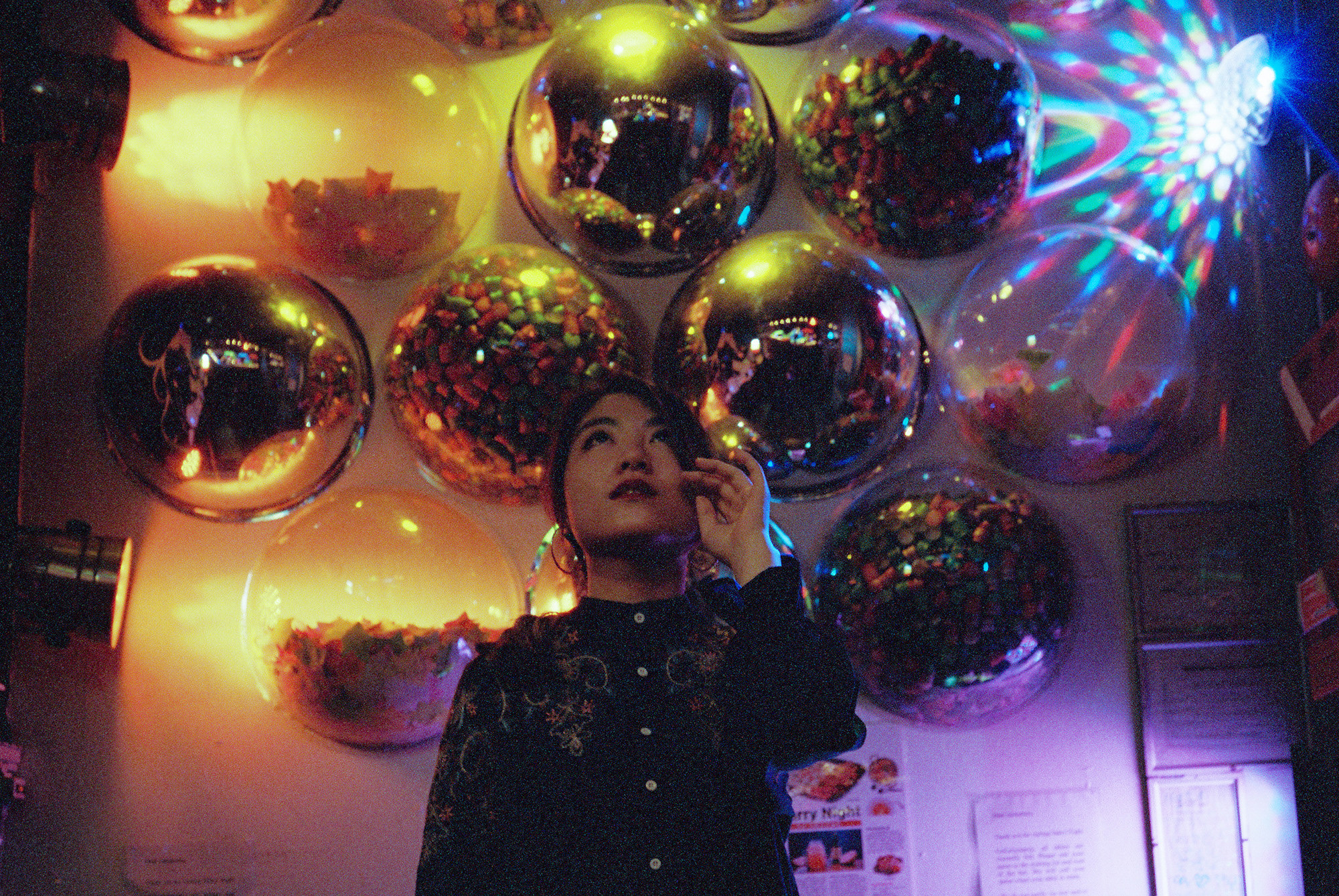 A woman looking up at balloons