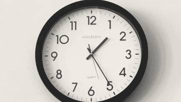 GIF of clock with a very fast-moving second hand